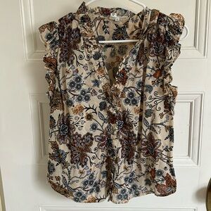 sleeveless cotton print ruffle edge top.